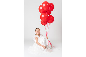 Smiling girl in white dress holding, a Person Photo by Alexander-Piragis