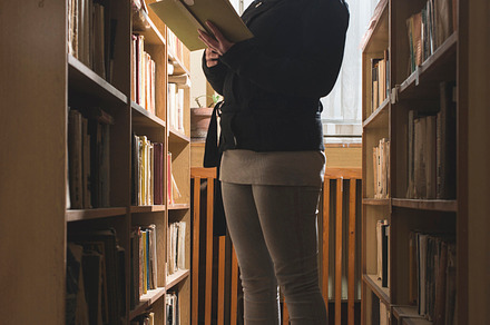 Young women in a vintage library stock photo containing library and young, a School & Education Photo by Deyan Georgiev