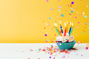 Birthday cupcake with many candles a