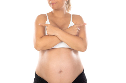 Image of pregnant woman touching her belly with hands, a Person Photo by José Manuel Gelpi