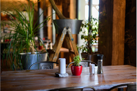 Modern restaurant with wooden tables, an Architecture Photo by HalfPoint