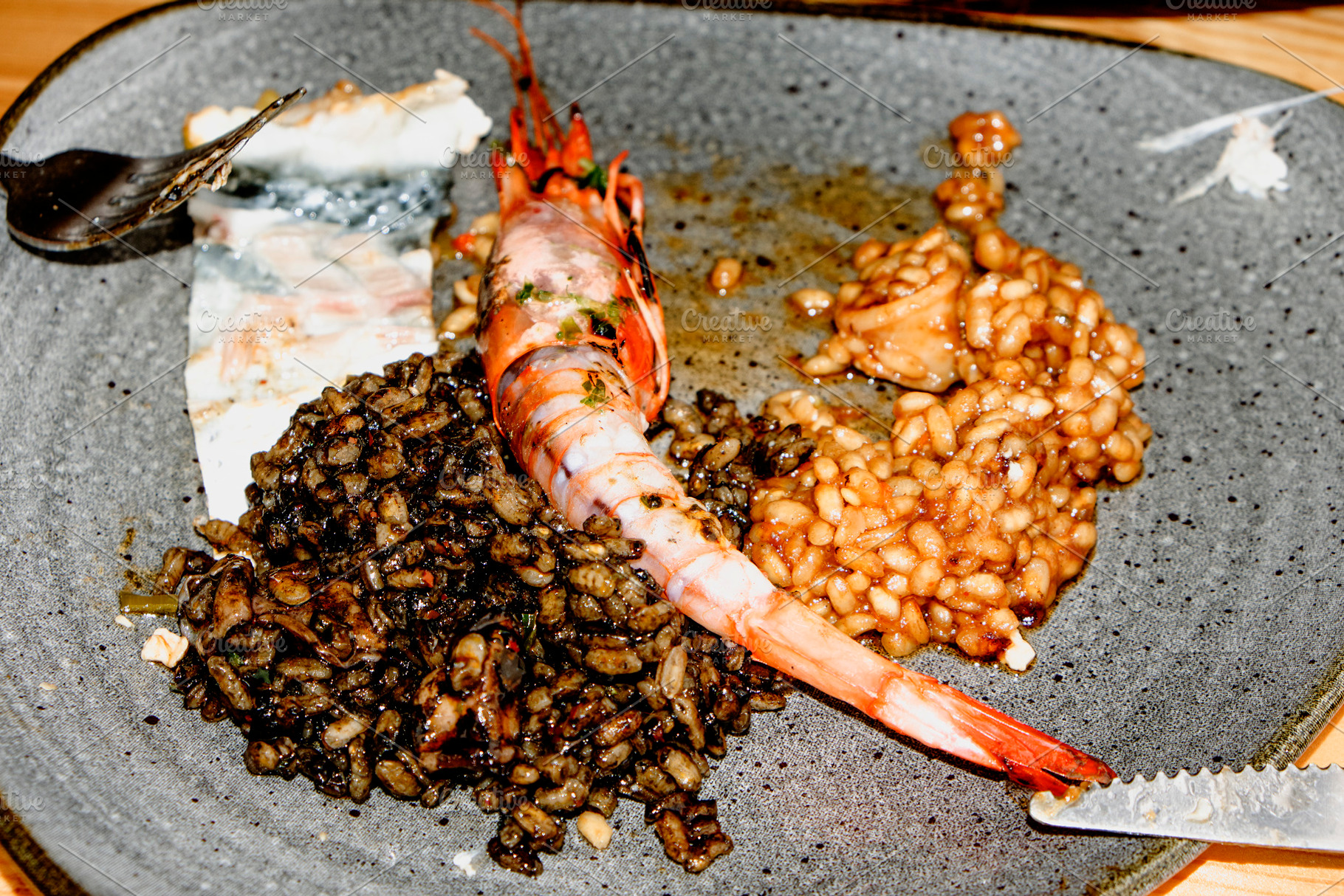 mixed rice with shrimp and fish on plate, a Photo by Nito