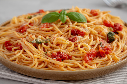 Homemade Spaghetti With Fresh Tomato Sauce on a Plate, side view, a Food & Drink Photo by LiudmylaChuhunova