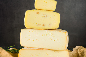 Set of various cheeses on wooden board. Large assortment of craf, a Food & Drink Photo by vimart
