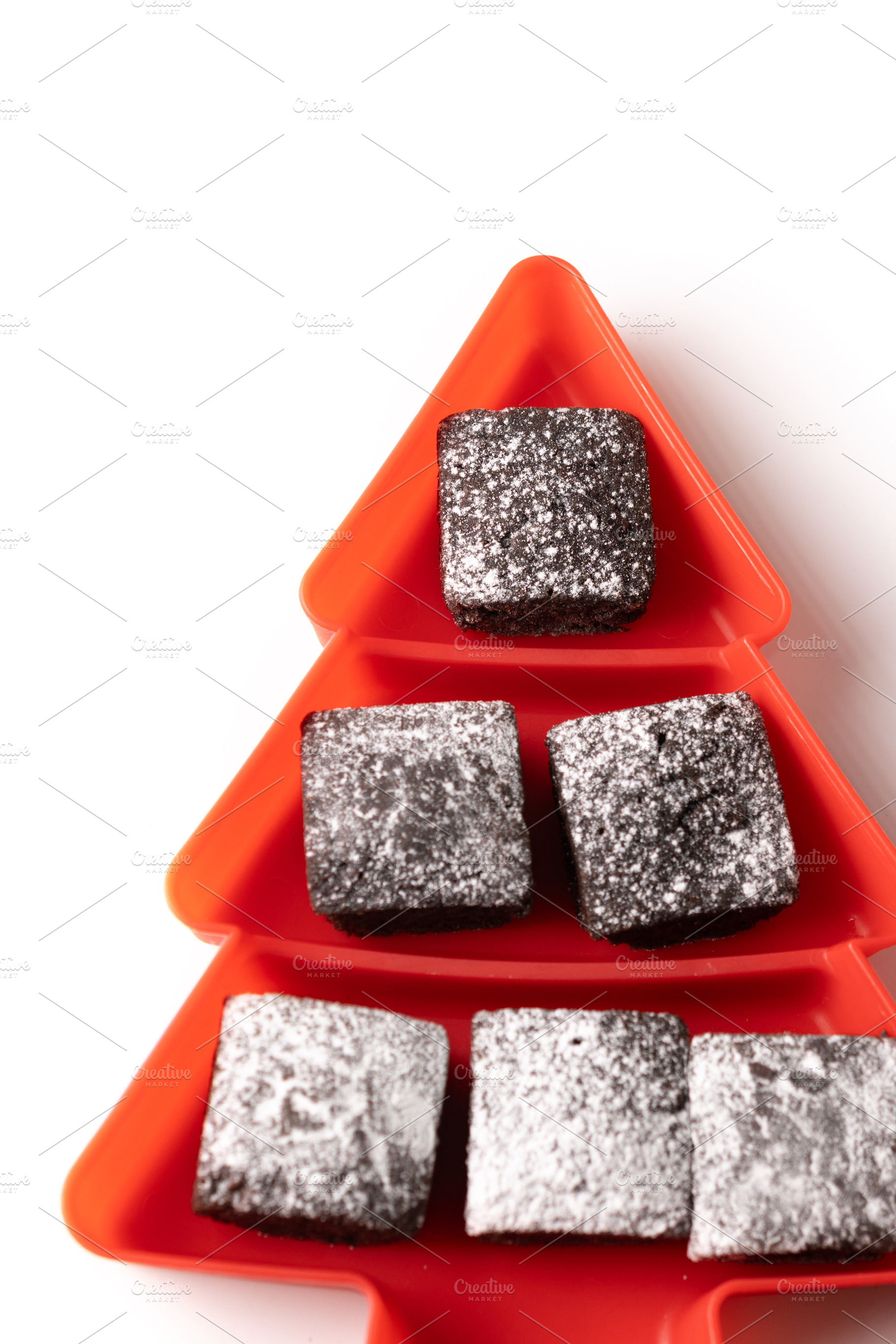 Chocolate brownies with powdered sugar in Christmas tree tray, a Food & Drink Photo by etorres69