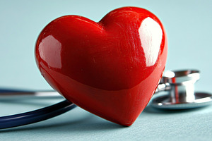 Red heart with stethoscope on blurred background, a Health & Medical Photo by AlyaAnd