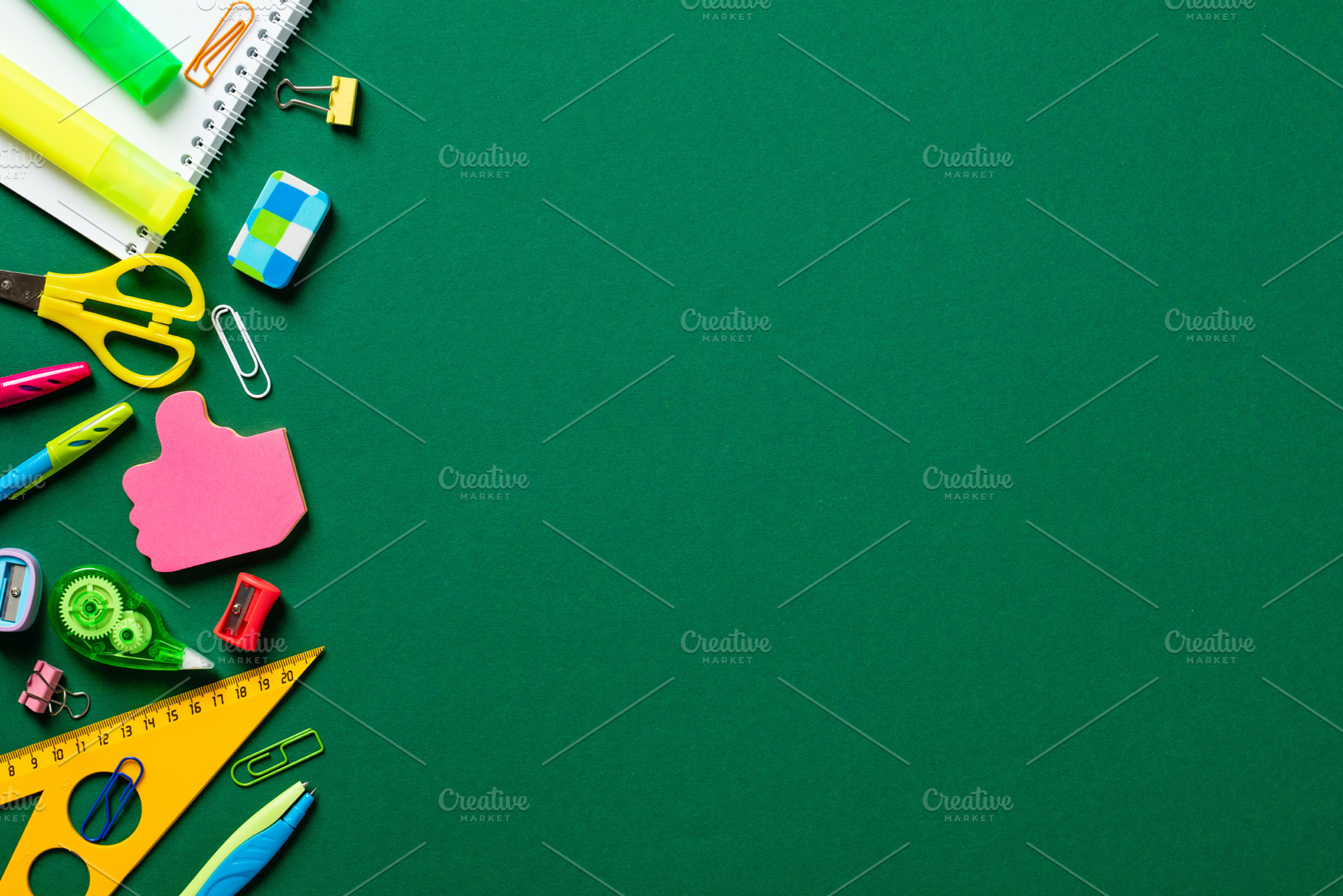 Back to school concept. Flat lay colorful school stationery on green background, a School & Education Photo by photoguns