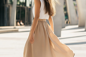 Woman in Flowing Skirt and Sneakers, a Person Photo by Ocean Digital Art