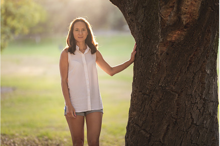 Adult white woman standing by tree, a Person Photo by Barcelona_dreams