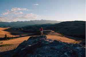 Woman Admiring Mountain Landscape at, a Person Photo by Jan Jack Russo Media