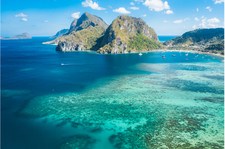 An aerial view of Corong beach with, a Nature Photo by Igor Tichonow