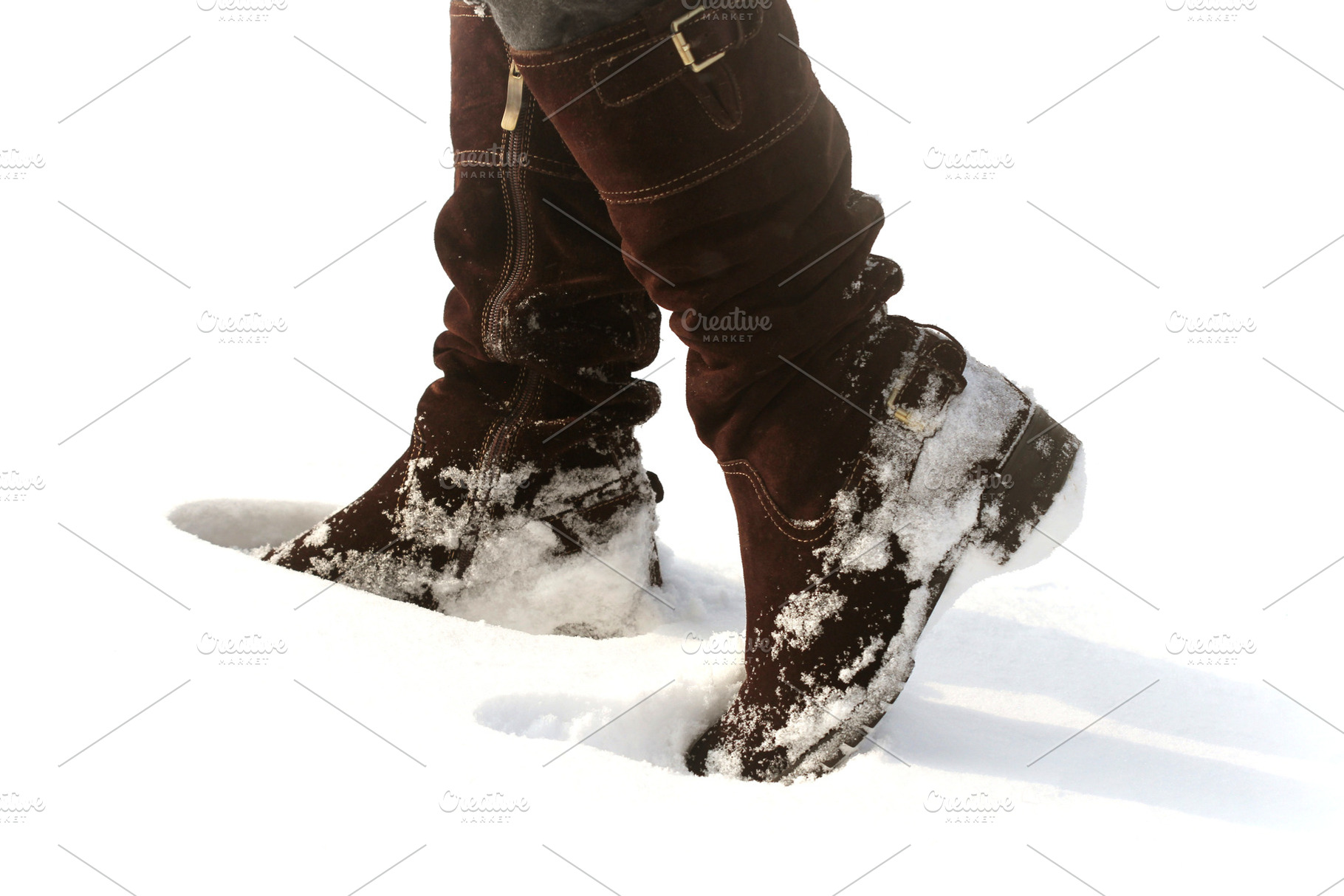 Brown women's shoes covered by snow in the winter featuring boot, snow, and, a Beauty & Fashion Photo by Vaivirga