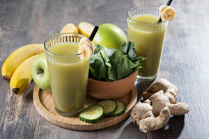 Green smoothie with spinach,banana, apple, and lemon on wooden tablespace, a Food & Drink Photo by etorres69