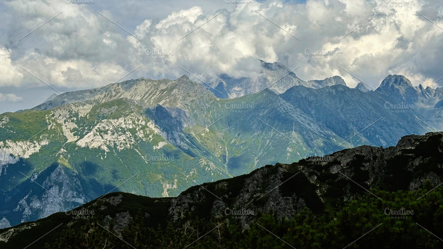 Scenic mountain range above Zakopane Poland with rocky ridges and dramatic clou, a Nature Photo by AS photostudio