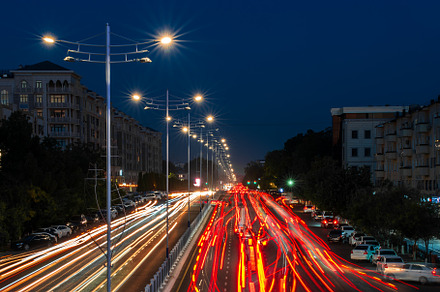 Blurred car traffic light at night city. Traffic jam in evening, a Transportation Photo by Eugene_Photo