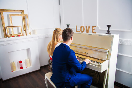 couple in love sitting in studio for piano, a Holiday Photo by Artsaba Family