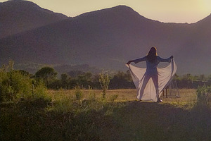 Woman in nature at sunrise expressing freedom, an Arts & Entertainment Photo by DanFLCreativo