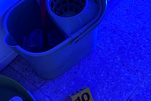 Crime scene evidence marker with mop bucket and blue light