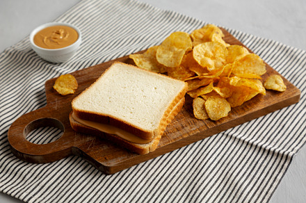 Homemade American Peanut Butter Sandwich on a Wooden Board, side
