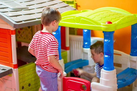 Children play in indoor playground.