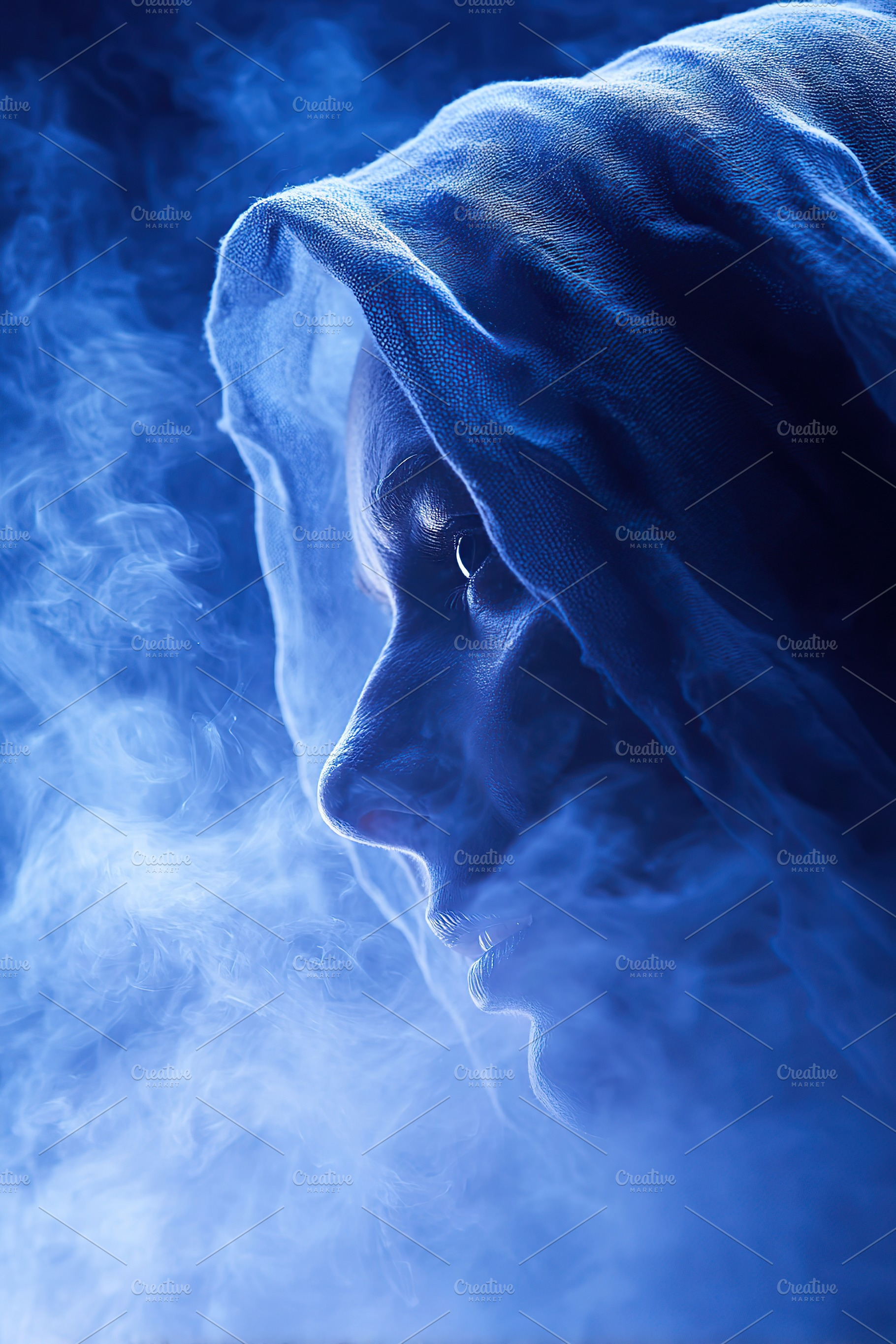 Portrait of a figure shrouded in mist with a blue hue in a mystical atmosphere, an Arts & Entertainment Photo by AlyaAnd