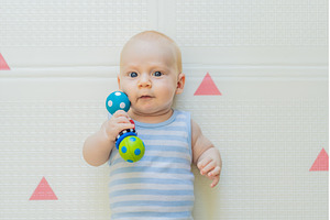 Adorable baby playing with colorful, a Person Photo by Elizaveta Galitskaya