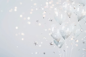 Delicate clear balloons with silver star confetti, softly lit against a white b, a Photo by Mashimara