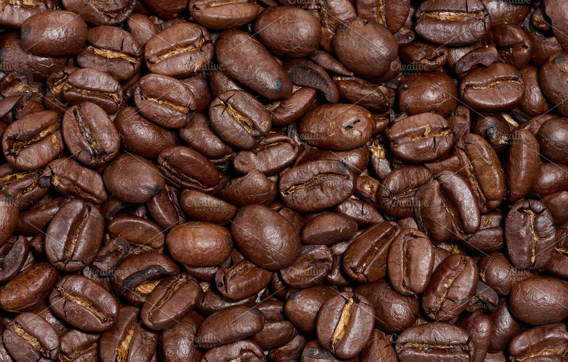 Scattered roasted coffee beans, full frame, a Food & Drink Photo by ndanko