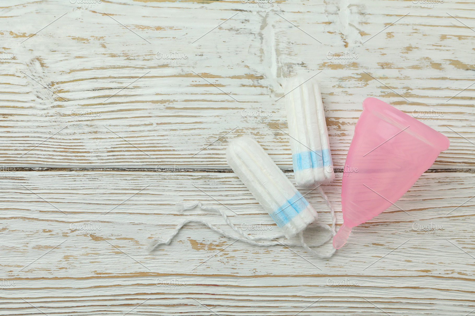 Concept of menstruation on wooden background, space for text, a Health & Medical Photo by AtlasStudio PRO