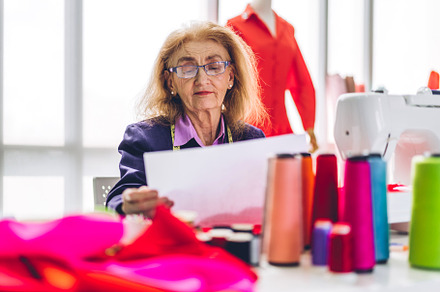 Portrait of elderly woman fashion designer stylish sitting and w, a Person Photo by Art_Photo