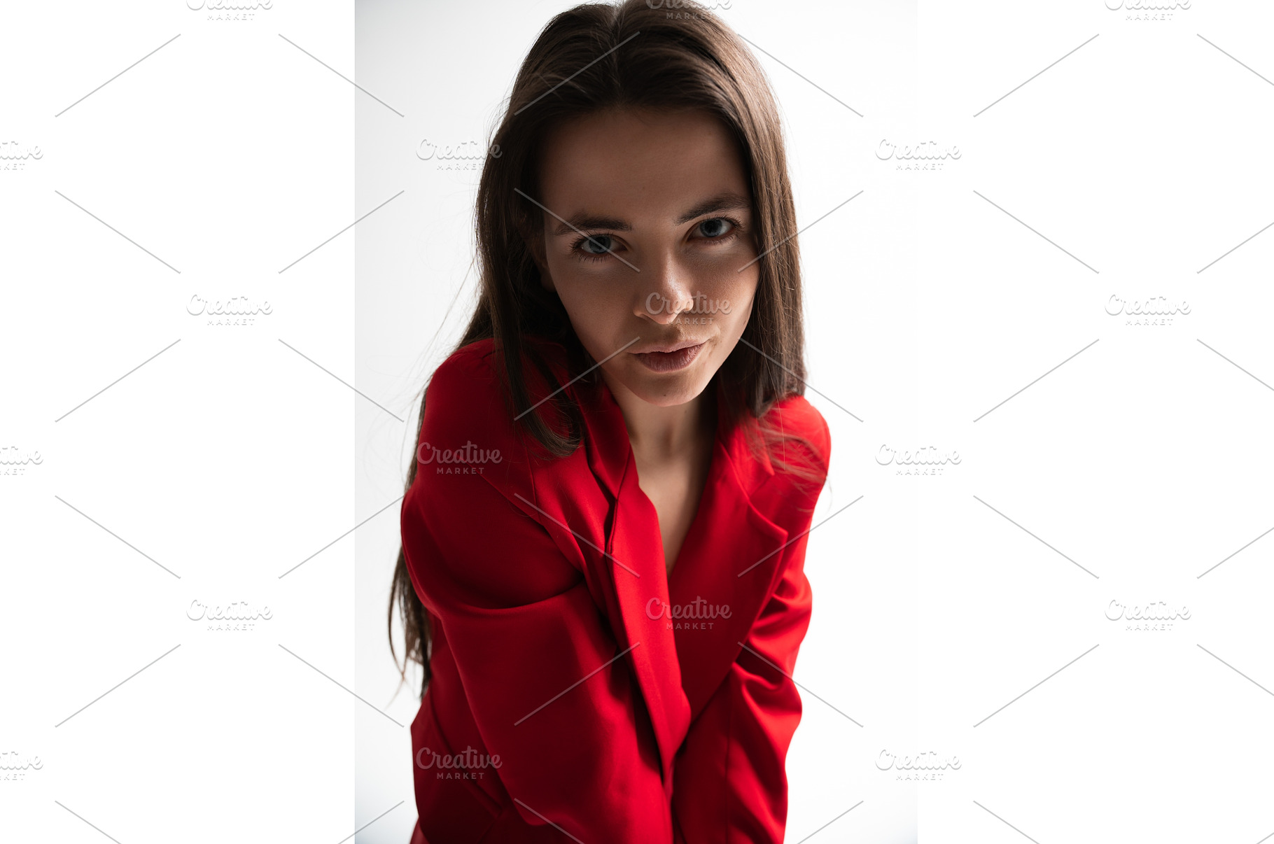 Young woman in a vibrant red blazer, a Person Photo by volodymyrshtun13795