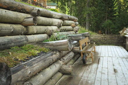 Wooden bench in mountain resort park in autumn season, a Nature Photo by AtlasStudio