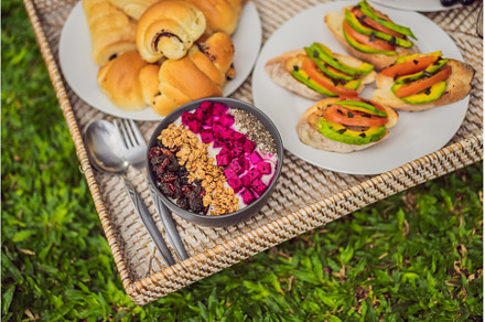 Breakfast on a tray with fruit, buns, a Food & Drink Photo by Elizaveta Galitskaya