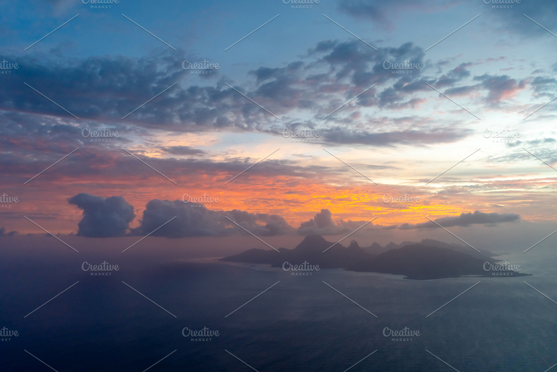 Aerial view of Moorea island at sunset, French Polynesia, a Photo by GoodGoods
