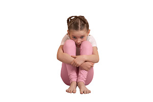 Young girl in pink leggings sitting on floor with knees hugged,, a Person Photo by Ales Munt