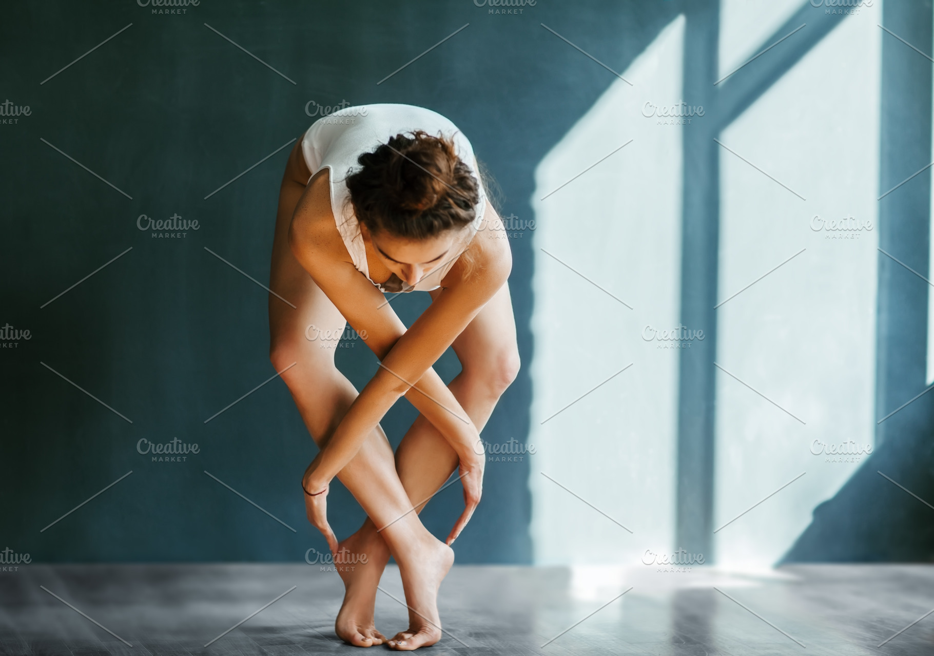 Dancer posing on a studio stock photo containing dance and ballerina, a Sports & Recreation Photo by Gladkov photography
