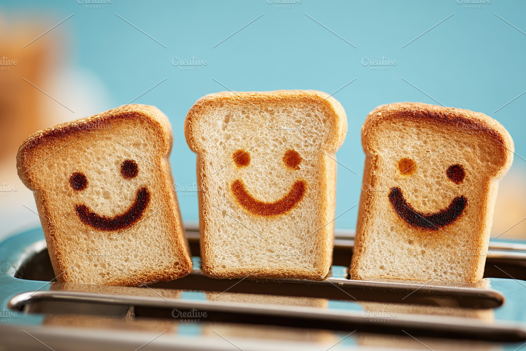 Popping out smiling toast slices from toaster for a cheerful breakfast moment, a Food & Drink Photo by AlyaAnd