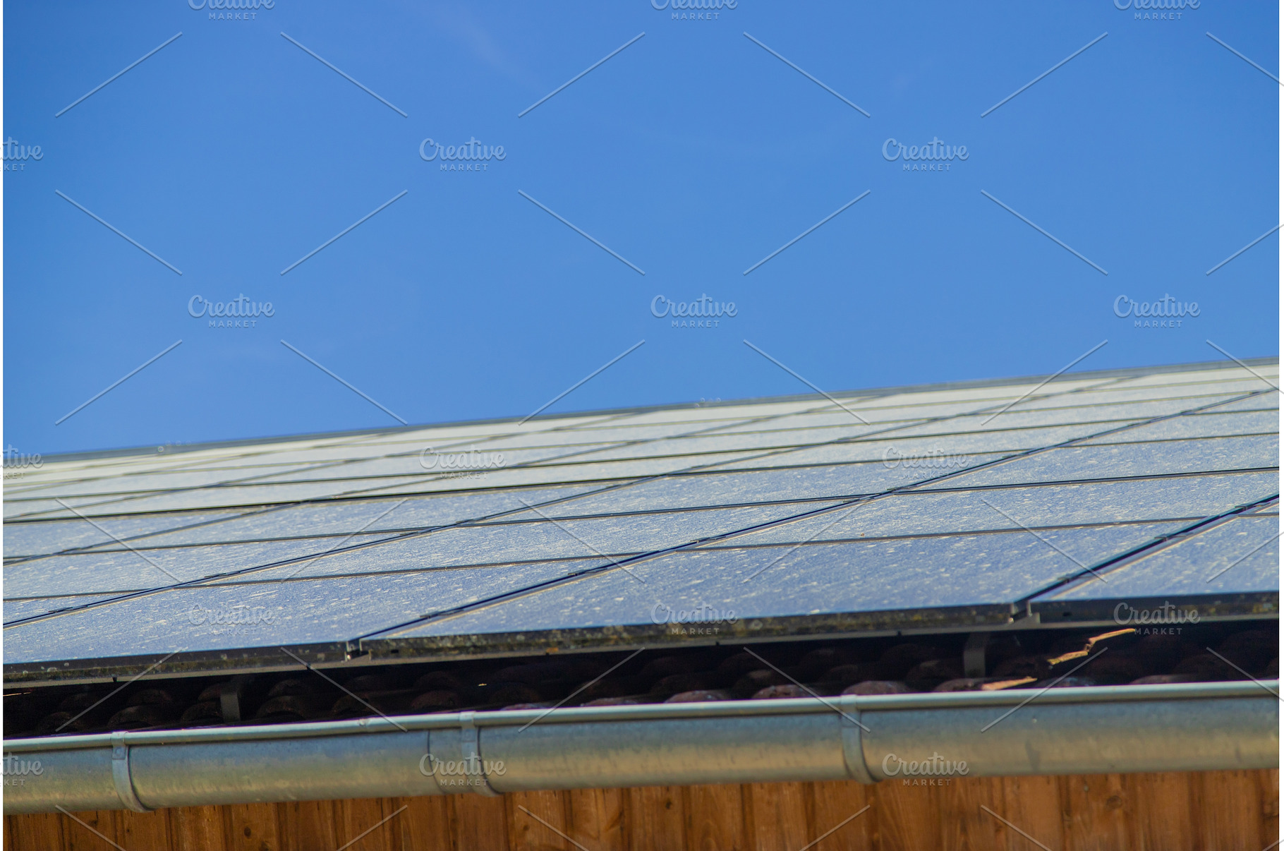 Solar panels dirty on the roof, an Industrial Photo by yanadjana