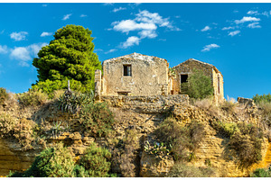 Ancient houses in the gardens of the Valley of the Temples - Agrigento, Sicily, an Architecture Photo by Leonid Andronov
