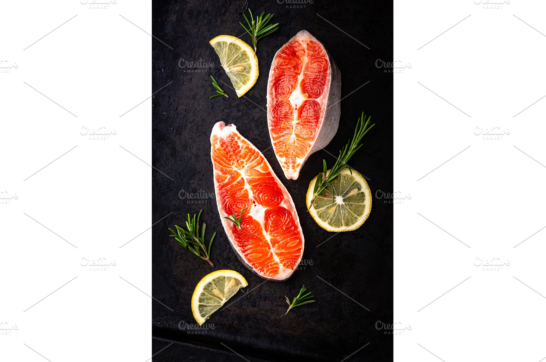 Raw uncooked salmon with rosemary, a Food & Drink Photo by Yulia Furman