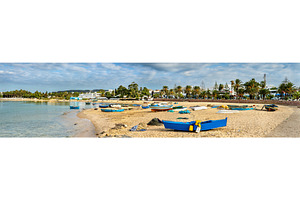 Wooden boats on the Mediterranean coast in Hammamet, Tunisia, an Architecture Photo by Leonid Andronov