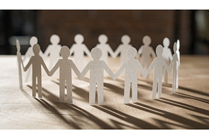 Ring of cutout white paper doll, a Person Photo by Igor Tichonow