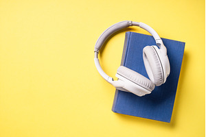 Headphones and books on blue, a School & Education Photo by Nadia-nb