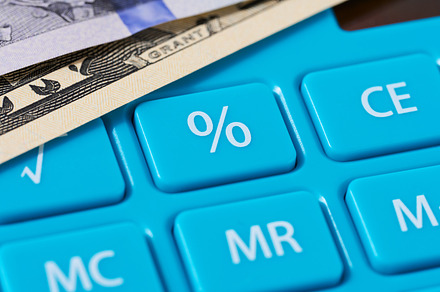 Percentage button on blue calculator, counting income, a Business Photo by ndanko