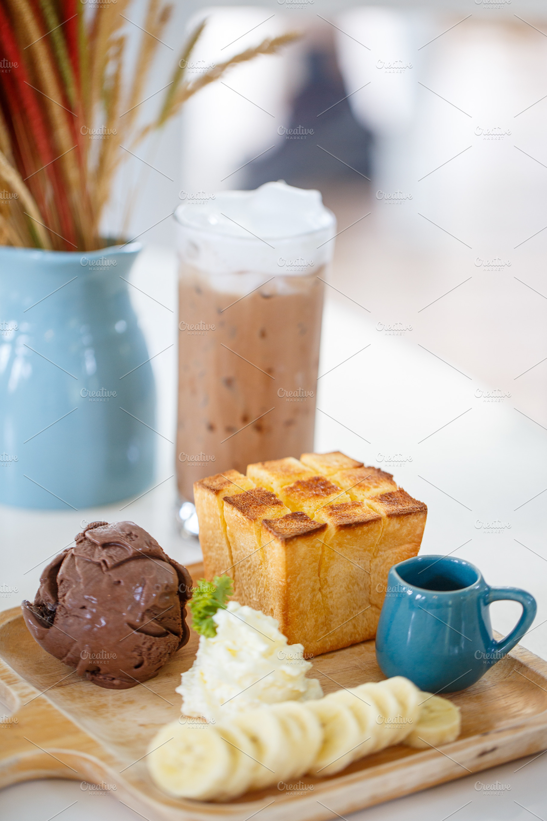 Delicious dessert with chocolate ice cream, whipped cream, and banana, a Food & Drink Photo by a454