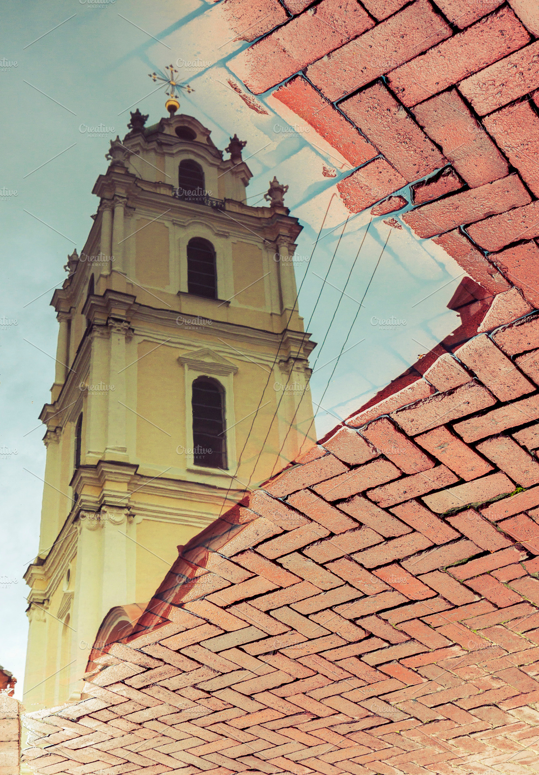 Church reflected in water puddle, an Architecture Photo by BOOCYS