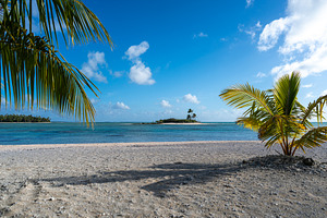 Tropical motus in Tikehau, French Polynesia, with clear lagoon w, a Photo by GoodGoods