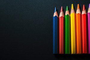 Colorful pencils arranged in a row, a Photo by Beautiful things
