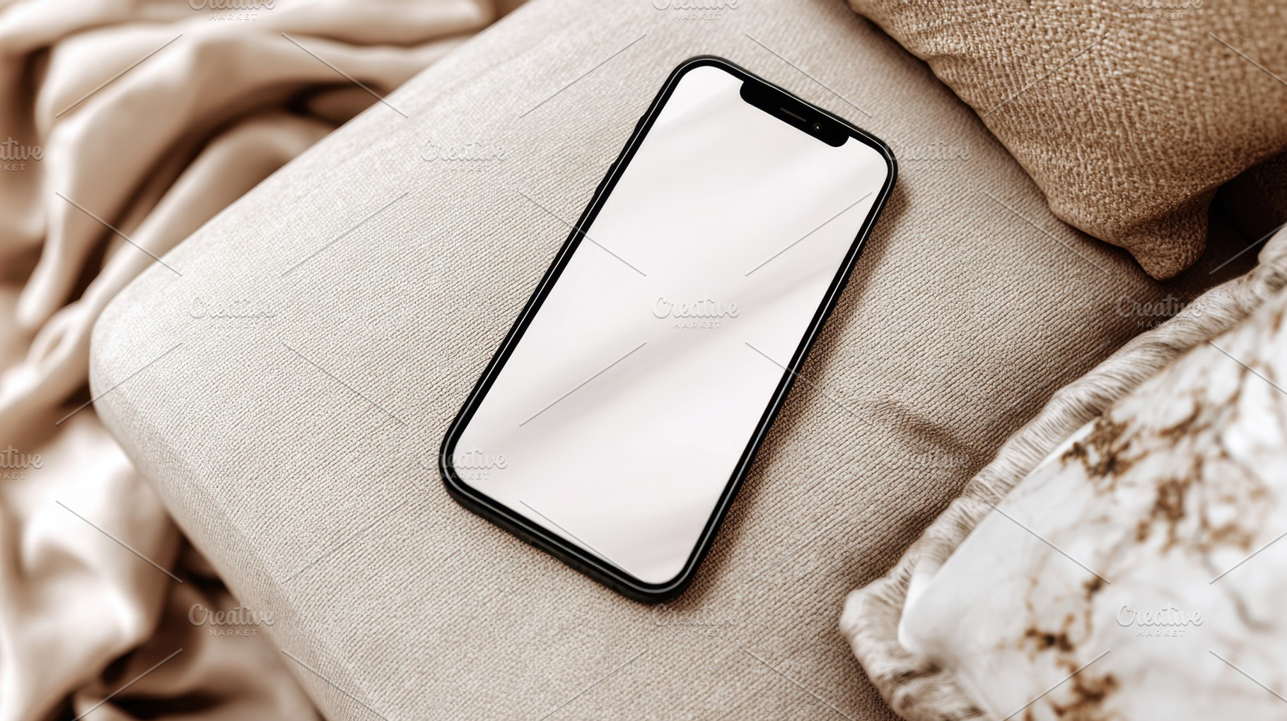 Smartphone resting on a soft surface, a Photo by Beautiful things