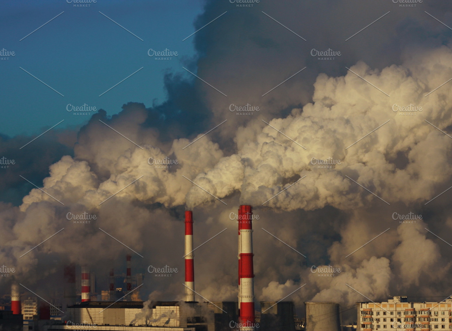 The smoke from pipes of the plant, an Industrial Photo by Wonderful World